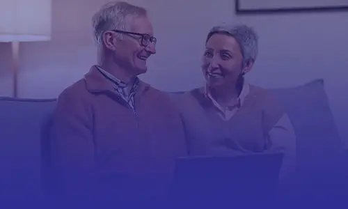 Two adults smiling together at home while building connection and emotional support