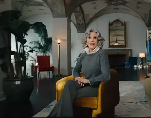 Jane Fonda smiling in a portrait for an article about aging well